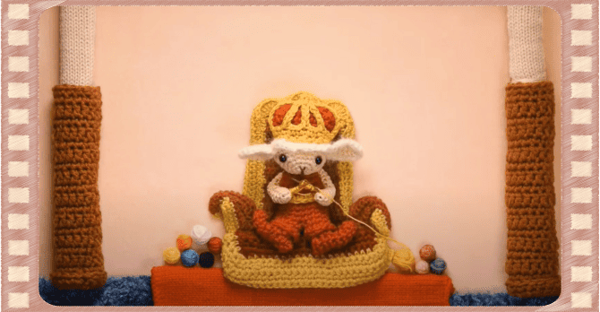 王さまがお城の中で編み物をしているシーン